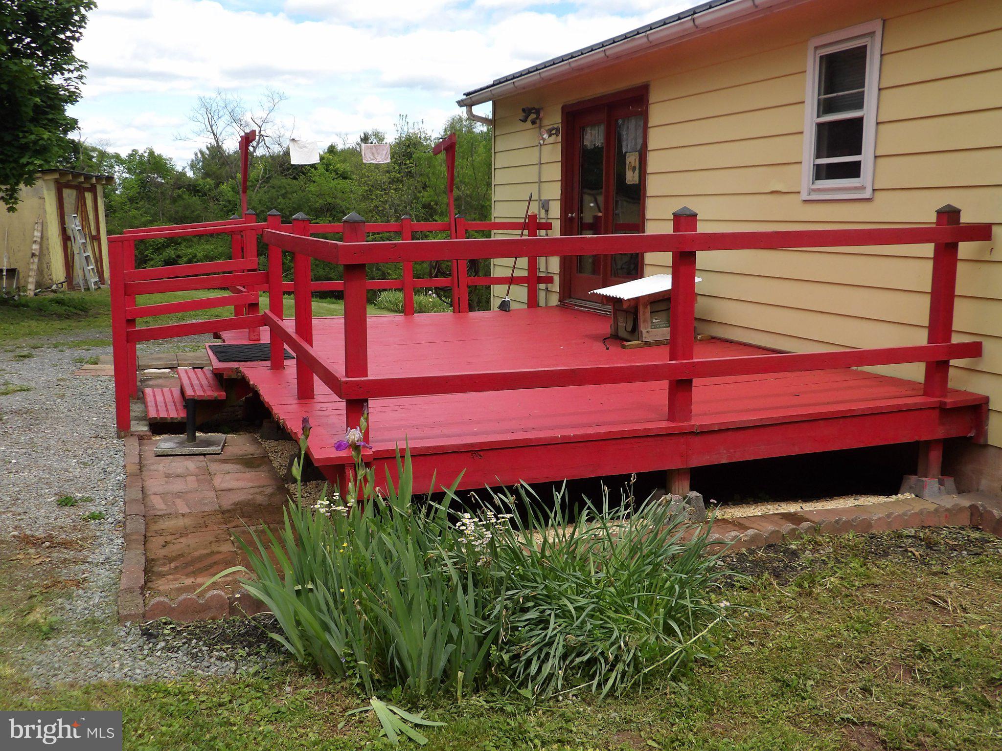1045 Lockport Road Lewistown, PA 17044 - Photo 19 of 51 Vibrant red deck invites outdoor living.