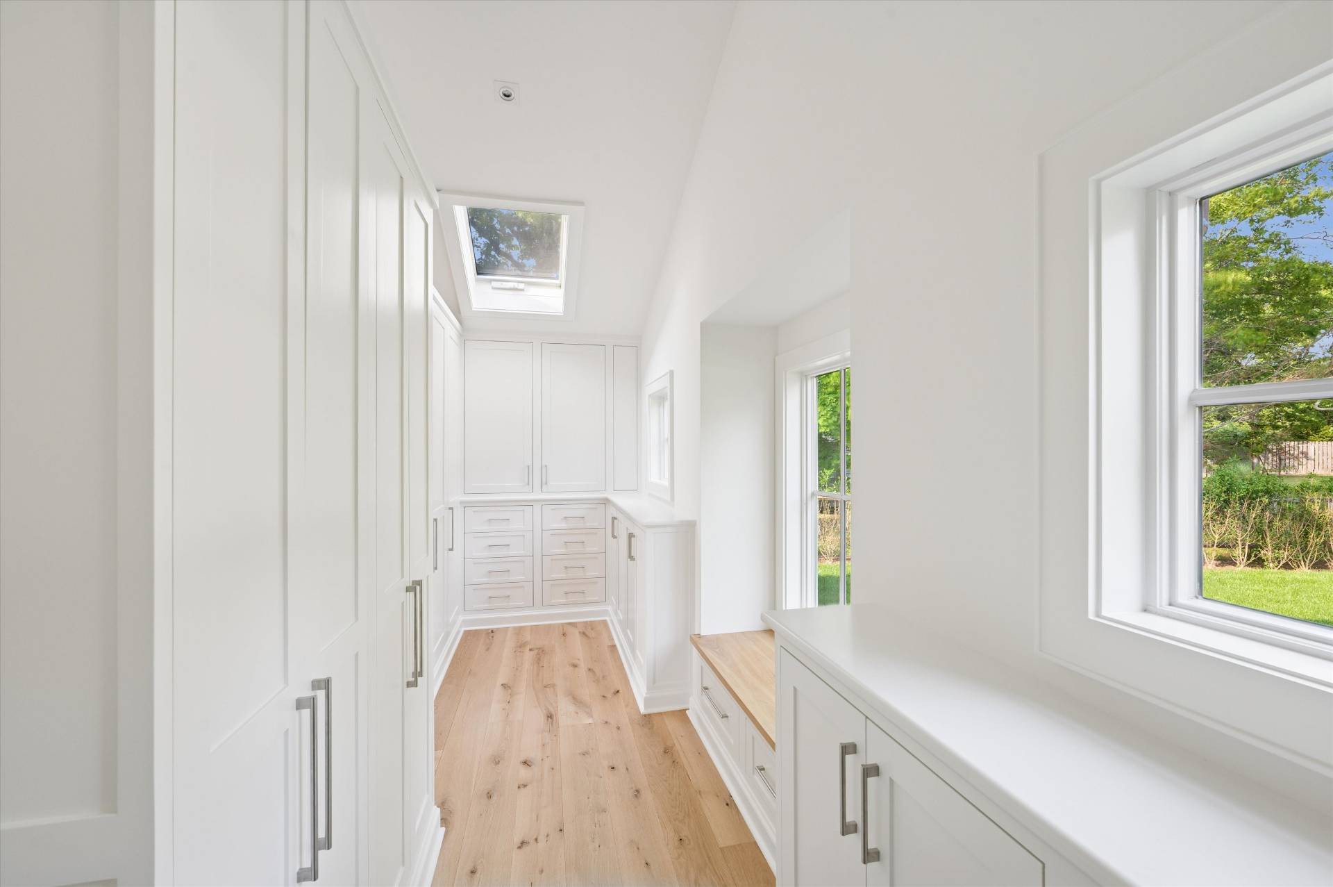 206 Water Hole Road East Hampton, NY 11937 - Photo 13 of 32 a view of hallway with window and wooden floor