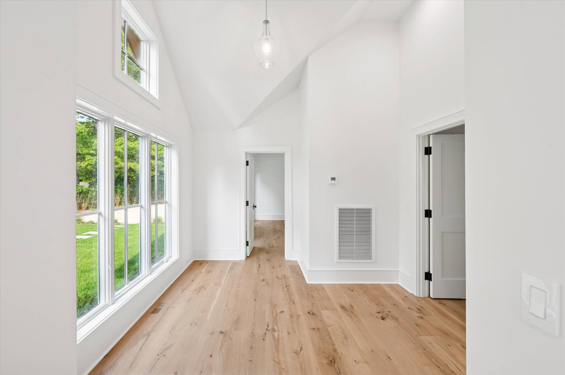 206 Water Hole Road East Hampton, NY 11937 - Photo 14 of 32 a view of an empty room with wooden floor and a window