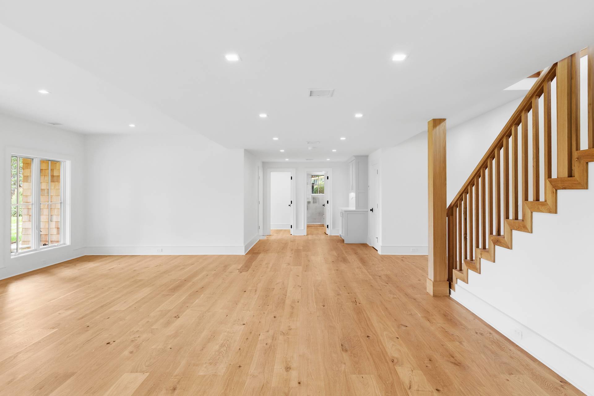 206 Water Hole Road East Hampton, NY 11937 - Photo 22 of 32 a view of empty room with wooden floor and windows