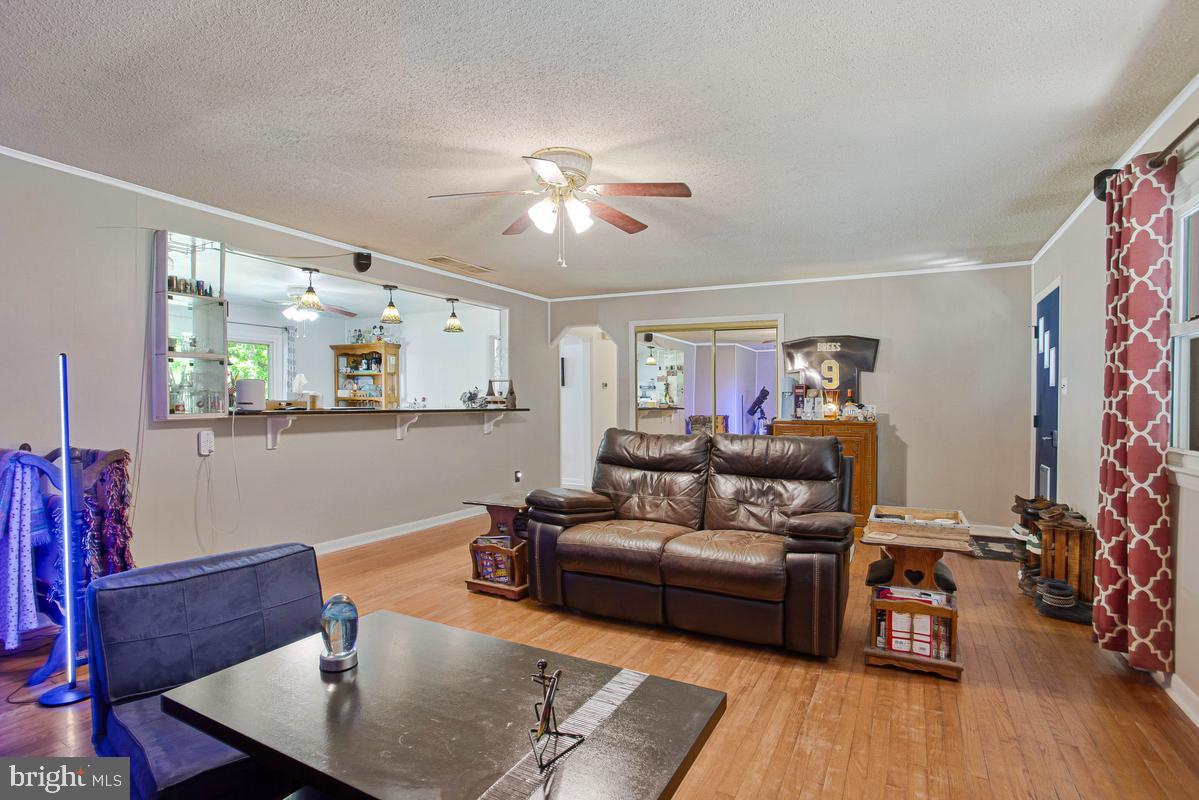 6600 Ashland Road La Plata, MD 20646 - Photo 14 of 40 a living room with furniture and wooden floor