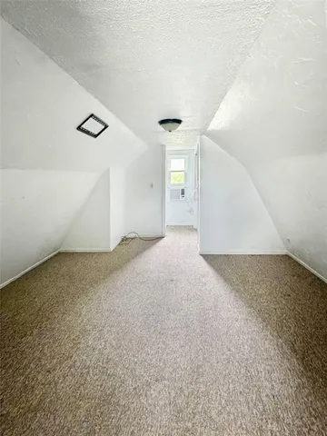 a view of a big room with closet and windows