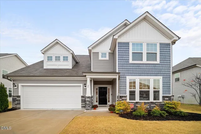 front view of a house with a yard