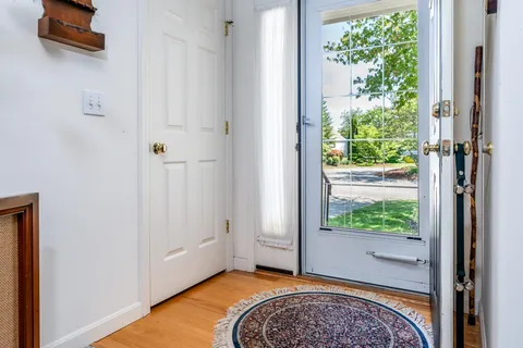 a view of bedroom with a bed and glass door