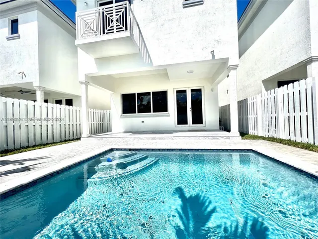 a view of a house with swimming pool