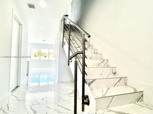 a view of entryway with wooden floor