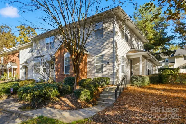 a backyard of a house with outdoor seating
