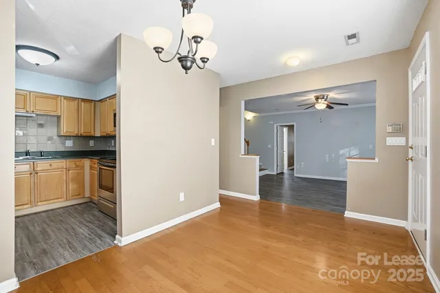 a view of a kitchen cabinets and a wooden floor