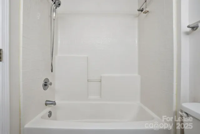 a close up of a bathtub in a bathroom