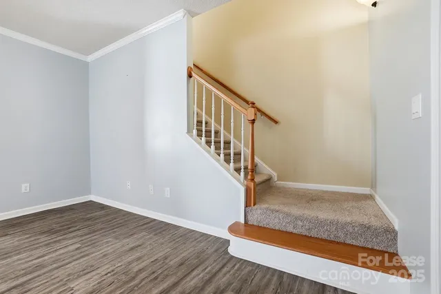 a view of entryway with wooden floor