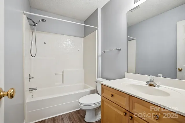 a bathroom with a sink a toilet and a bathtub
