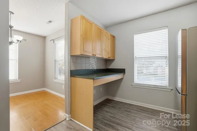 a kitchen with a sink and a window