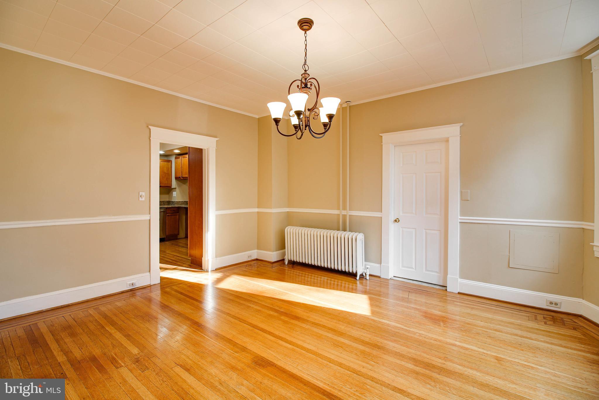 211 Mallow Hill Road Baltimore, MD 21229 - Photo 11 of 49 a view of a livingroom with wooden floor