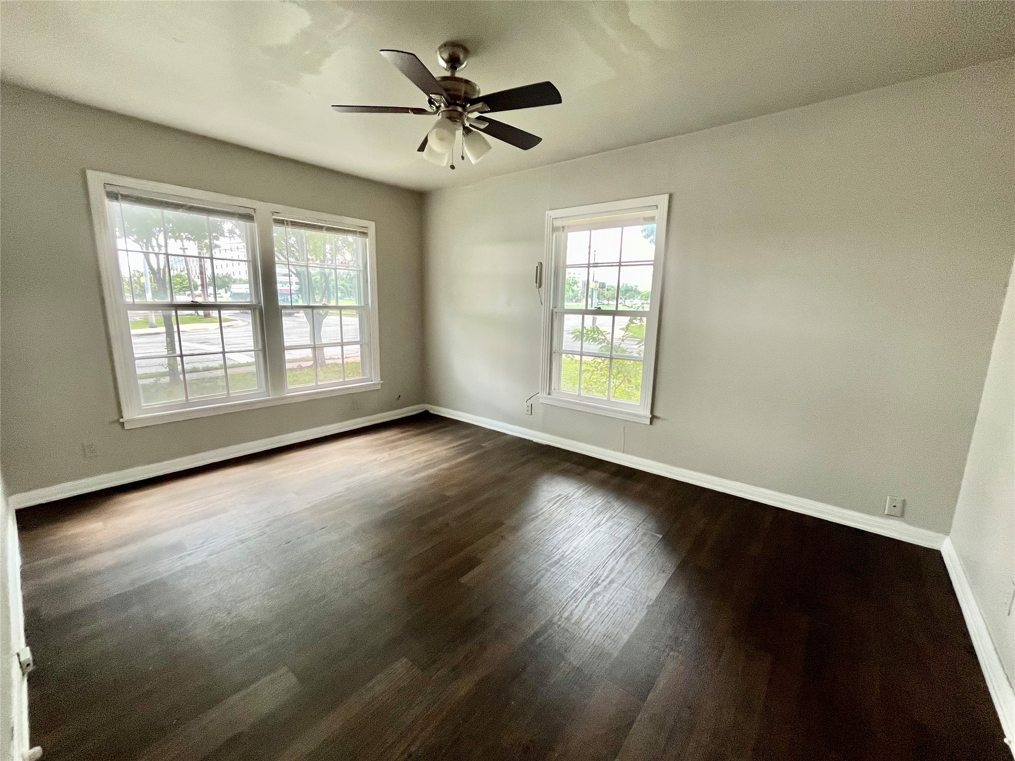 5101 Guadalupe Street, Unit A Austin, TX 78751 - Photo 17 of 28 a view of an empty room with wooden floor and a window