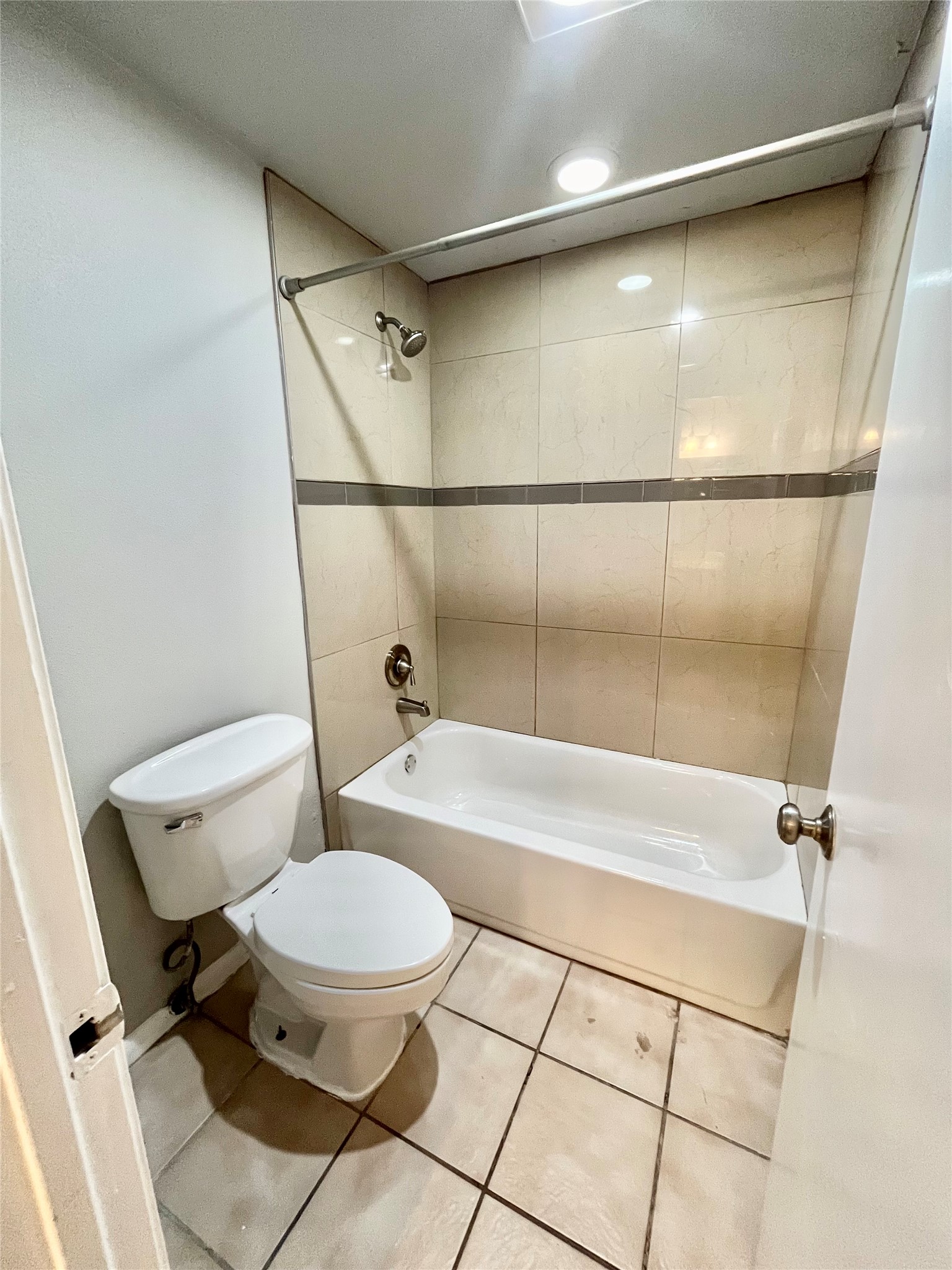 5101 Guadalupe Street, Unit A Austin, TX 78751 - Photo 22 of 28 Bathroom featuring shower / tub combination and tile patterned flooring