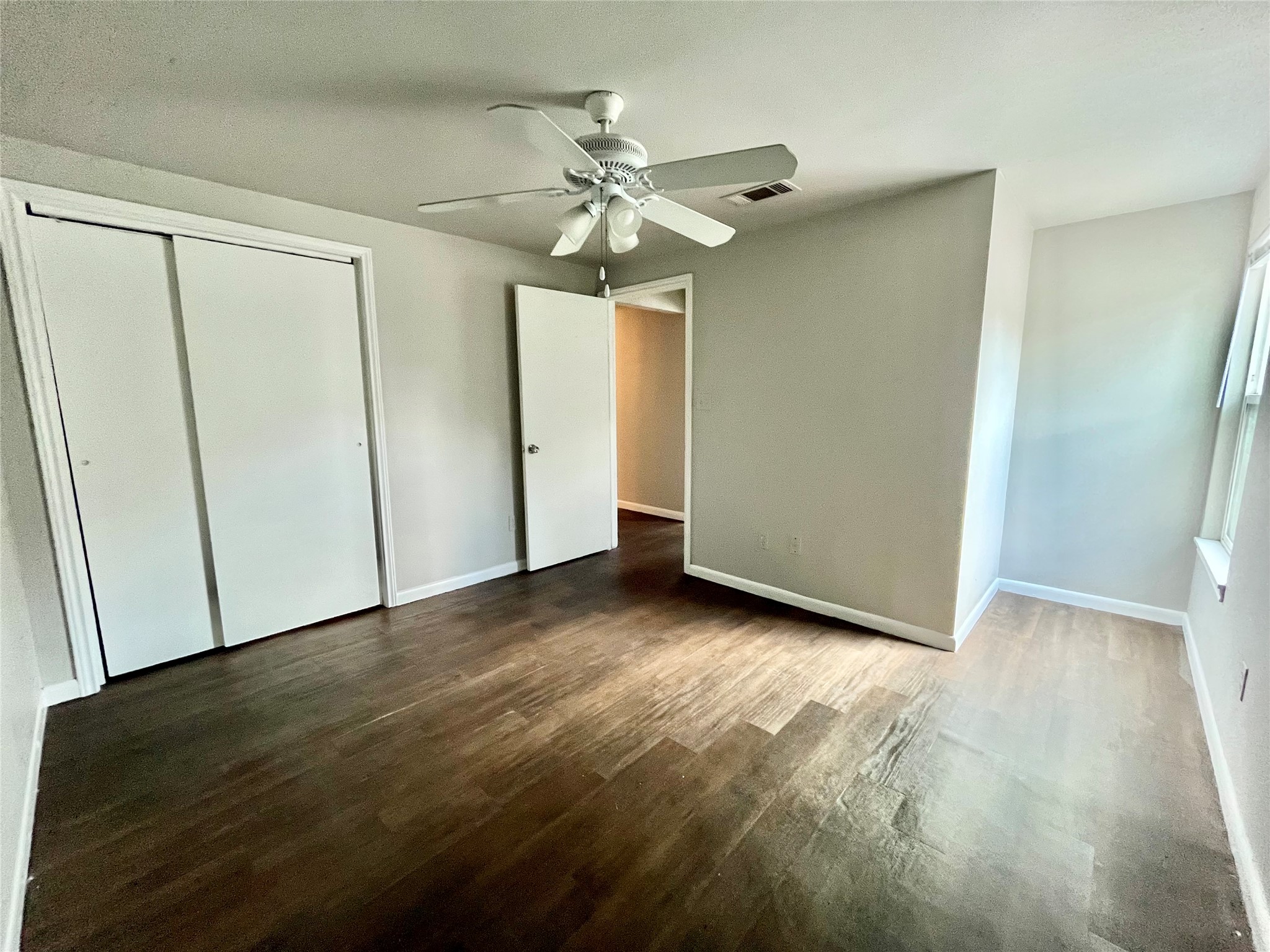 5101 Guadalupe Street, Unit A Austin, TX 78751 - Photo 23 of 28 a view of an empty room with a fan
