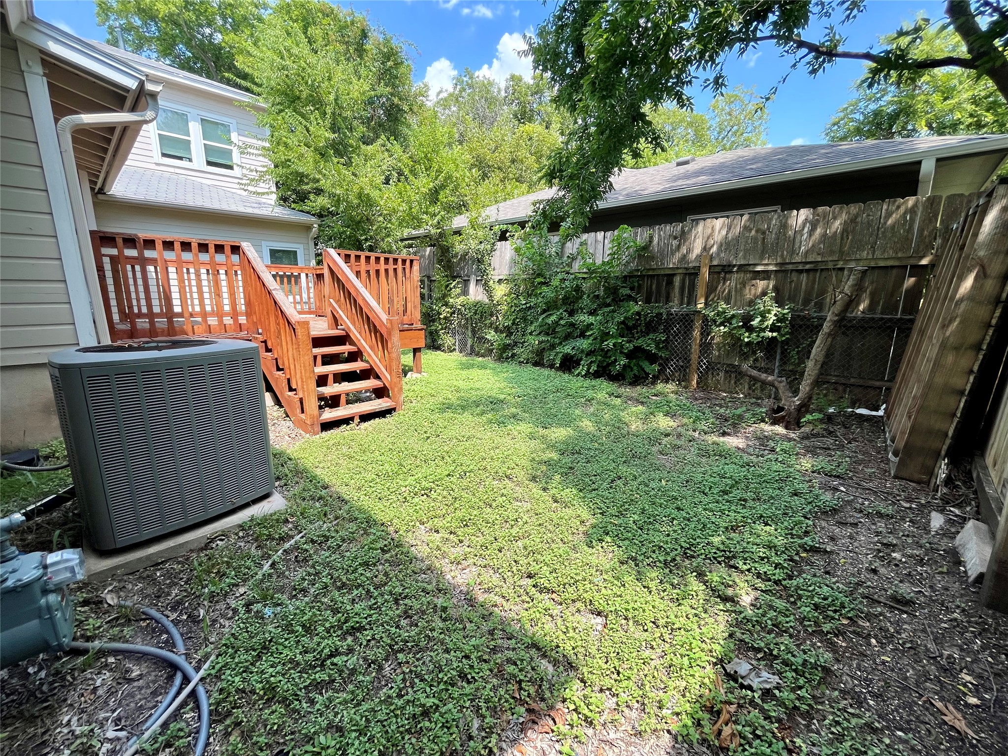 5101 Guadalupe Street, Unit A Austin, TX 78751 - Photo 26 of 28 a view of a backyard with plants and a swing