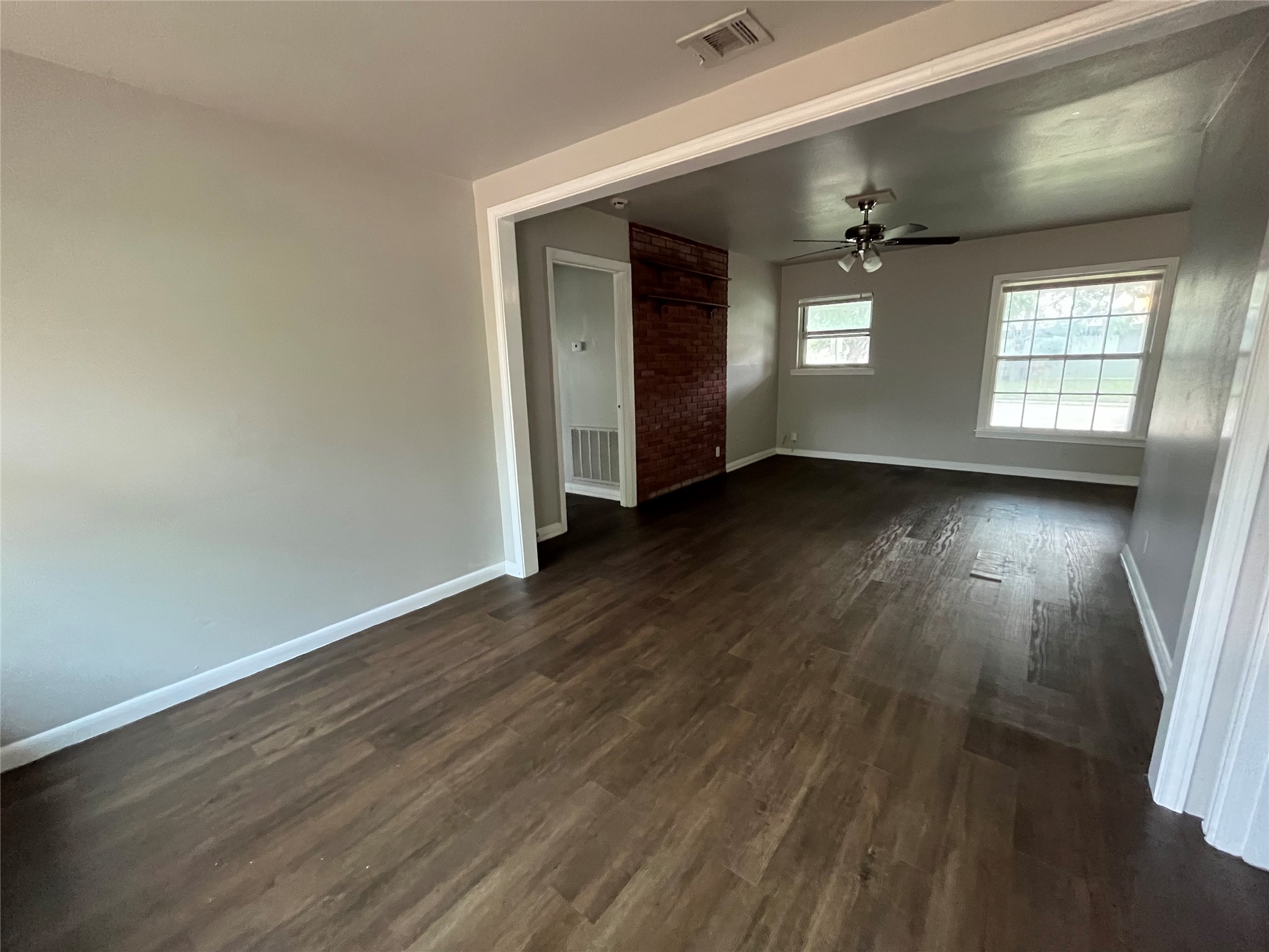 5101 Guadalupe Street, Unit A Austin, TX 78751 - Photo 4 of 28 Spare room with dark wood finished floors and ceiling fan