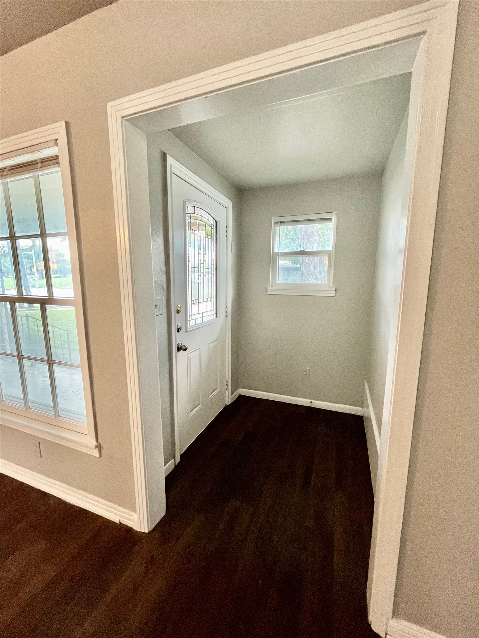 5101 Guadalupe Street, Unit A Austin, TX 78751 - Photo 9 of 28 a view of an empty room with wooden floor and a window