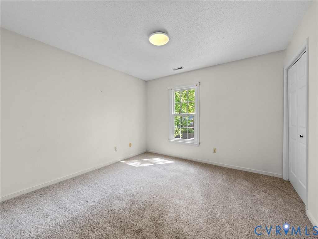 10713 Hamlin Way Chester, VA 23831 - Photo 35 of 49 Spacious upstairs bedroom with fresh updates! Feat
