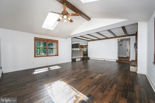a utility room with cabinets washer and dryer