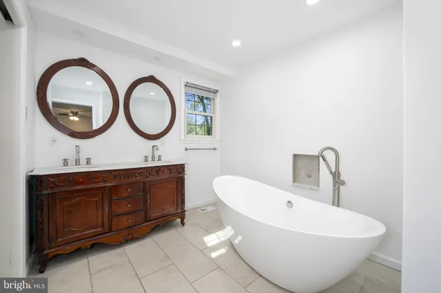 a white toilet sitting next to a shower