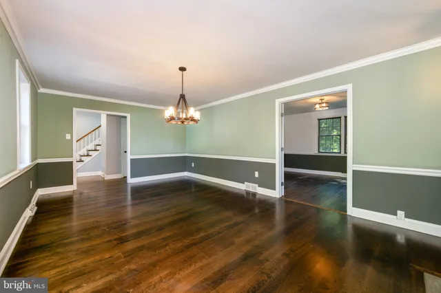 a view of livingroom with hardwood floor and a ceiling fan