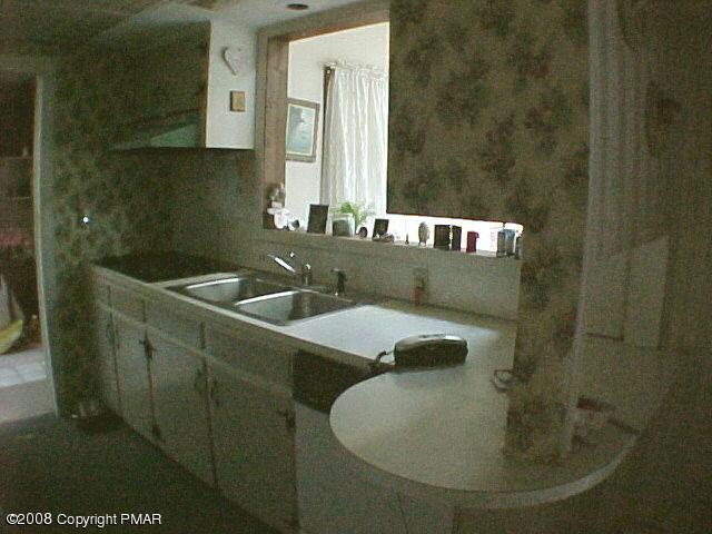 68 Woodland Road Mount Pocono, PA 18344 - Photo 7 of 11 a bathroom with a sink and a mirror