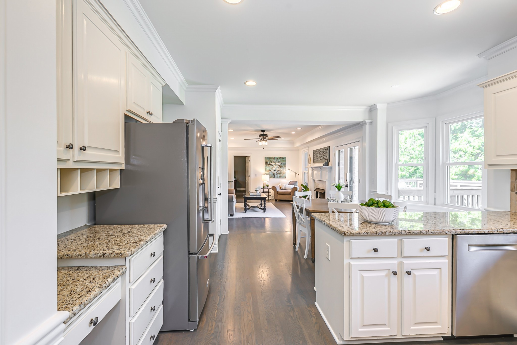 8204 Alamo Road Brentwood, TN 37027 - Photo 13 of 41 a kitchen with a refrigerator a stove a sink dishwasher a oven with white cabinets and wooden floor