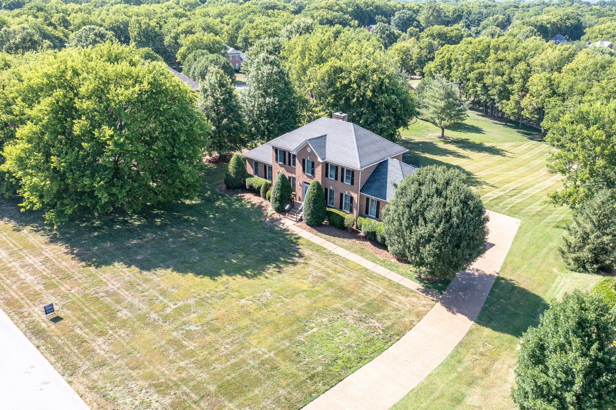 8204 Alamo Road Brentwood, TN 37027 - Photo 2 of 41 a view of a house with a yard