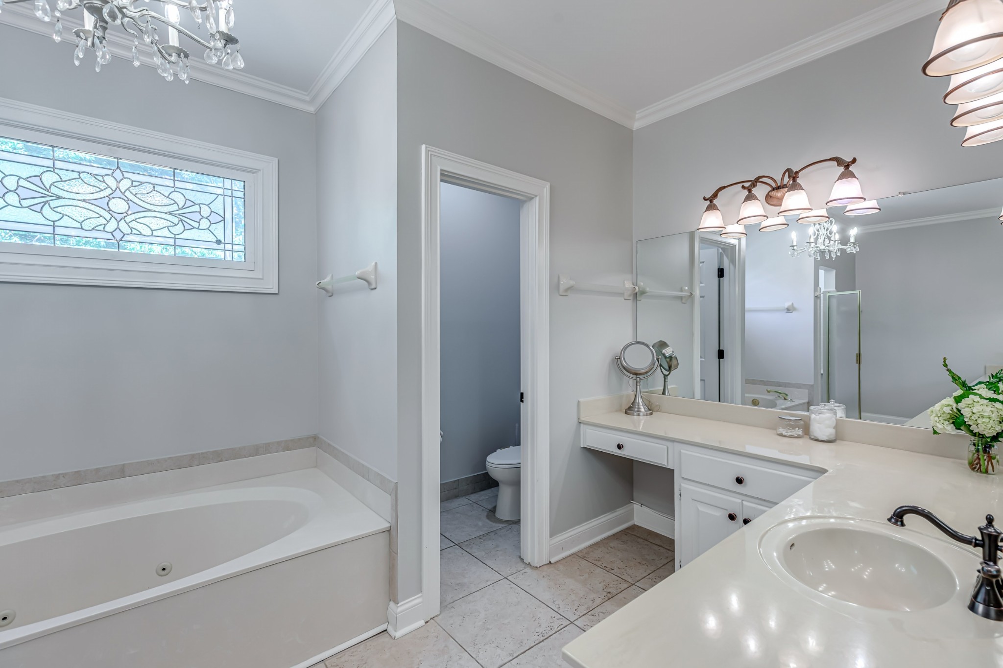 8204 Alamo Road Brentwood, TN 37027 - Photo 21 of 41 a spacious bathroom with a bathtub double sink and a mirror