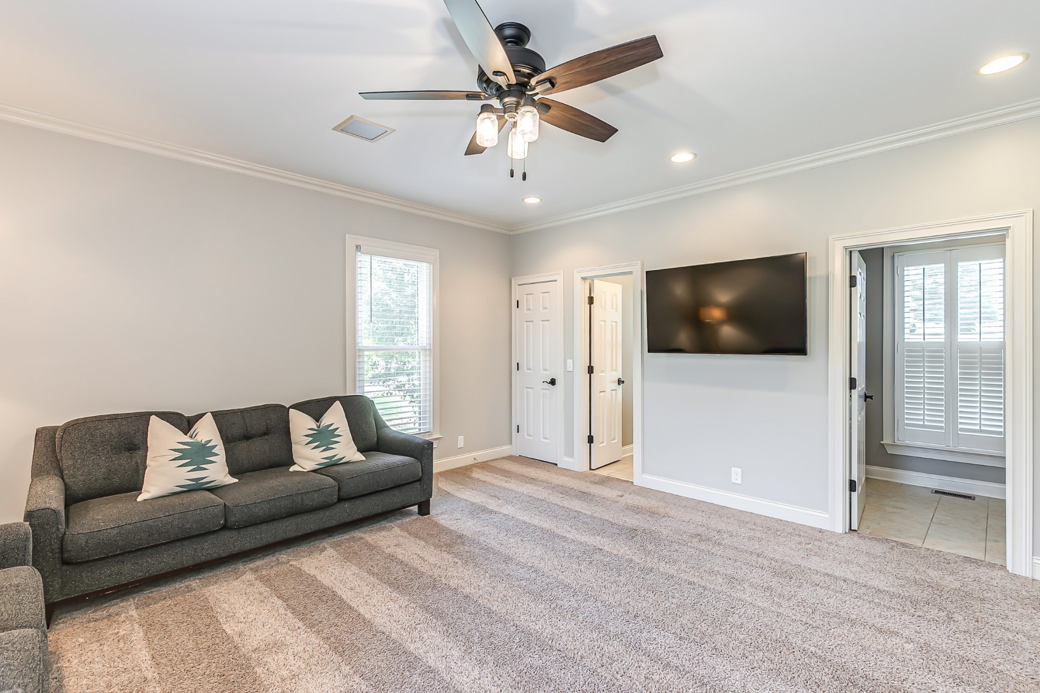 8204 Alamo Road Brentwood, TN 37027 - Photo 23 of 41 a living room with furniture and a flat screen tv
