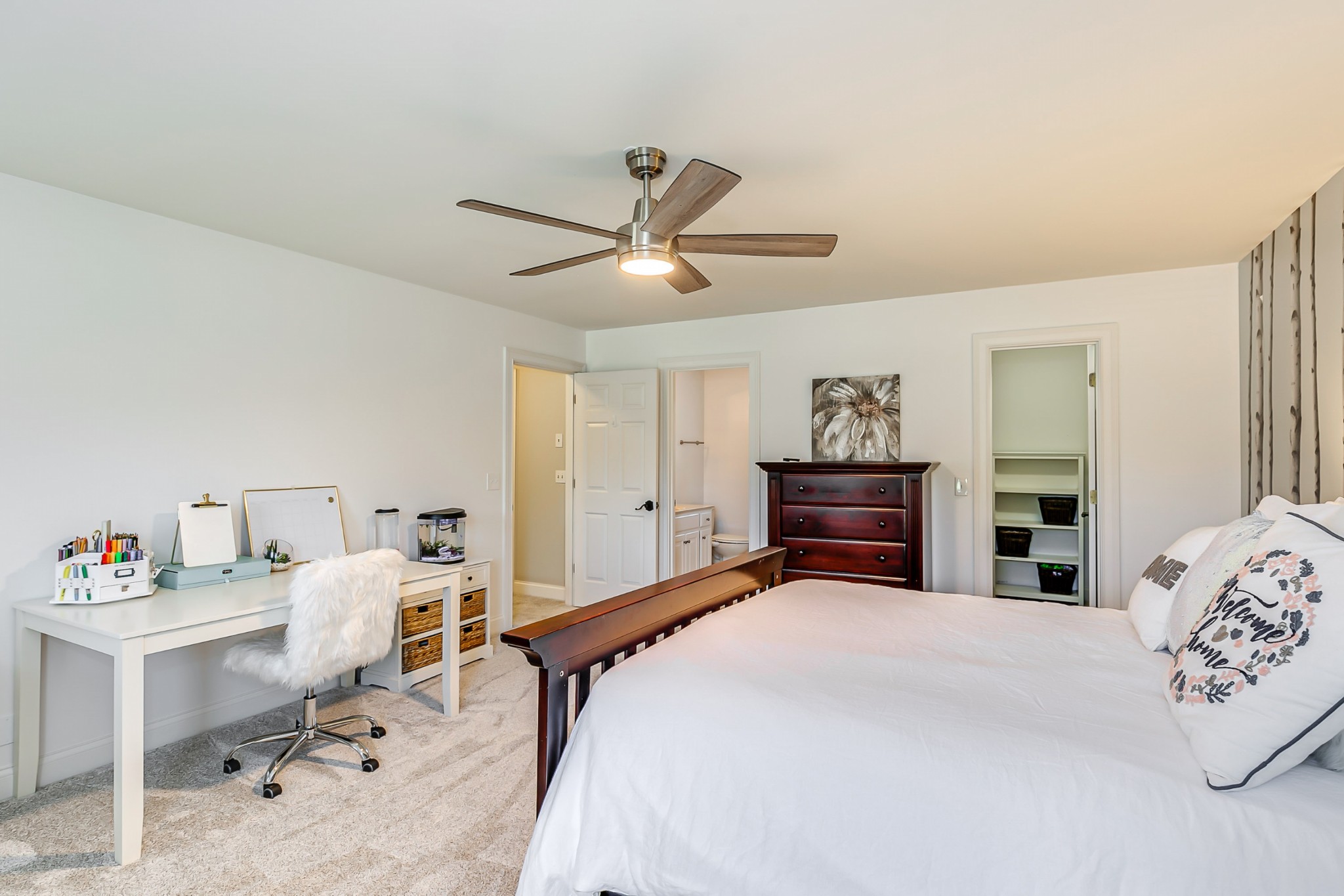 8204 Alamo Road Brentwood, TN 37027 - Photo 27 of 41 a bedroom with a bed and a chandelier