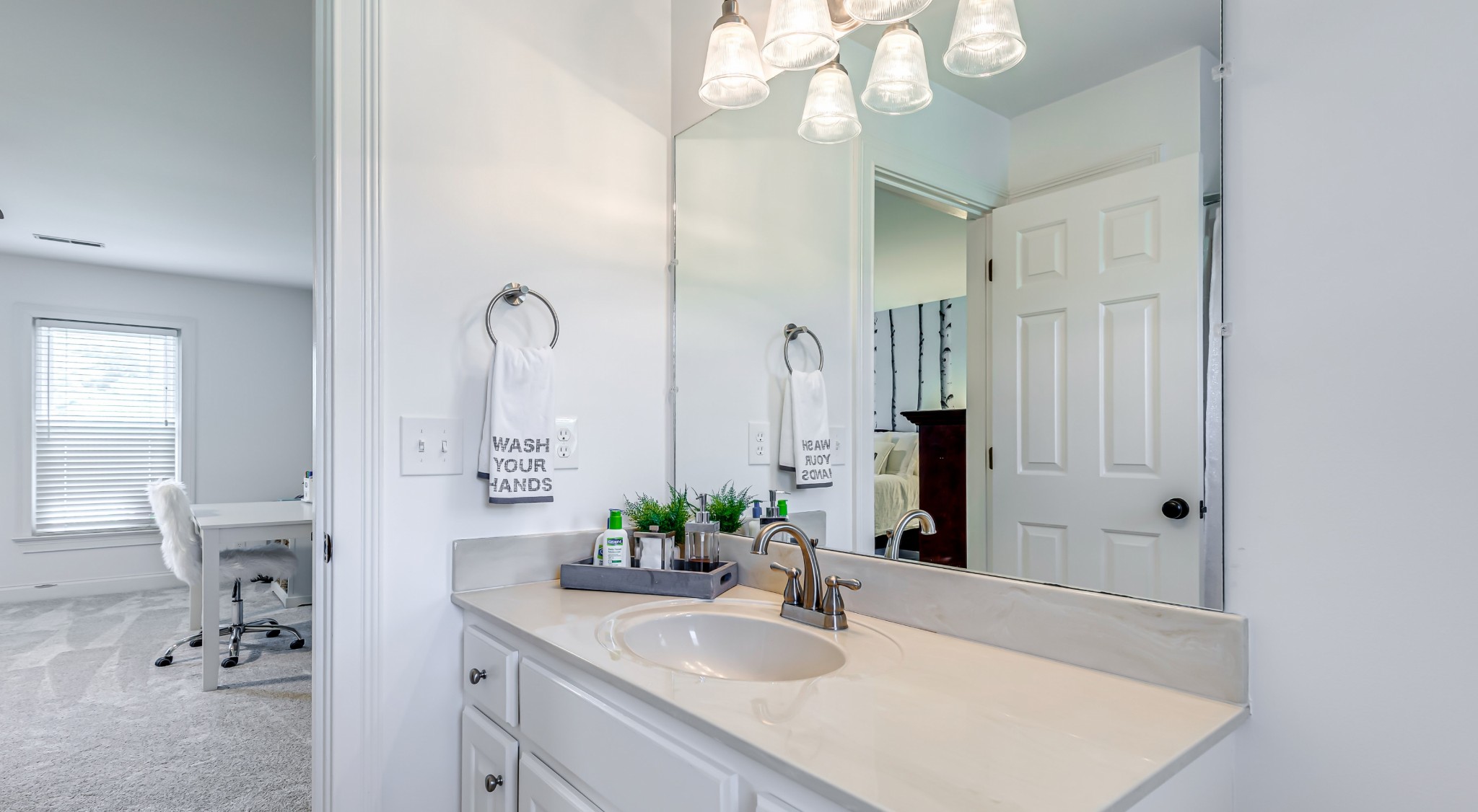 8204 Alamo Road Brentwood, TN 37027 - Photo 28 of 41 a bathroom with a sink a light fixture and a mirror