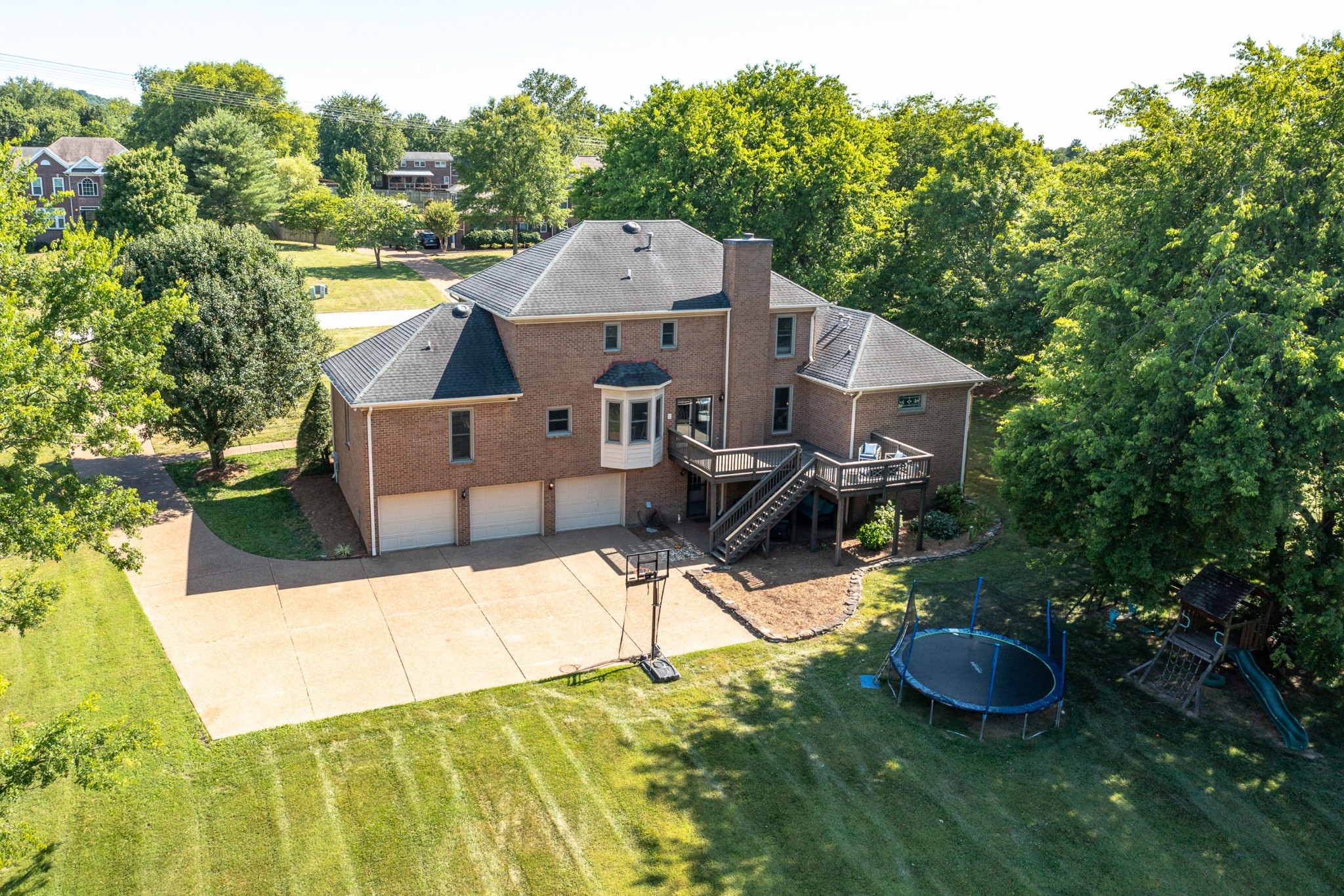 8204 Alamo Road Brentwood, TN 37027 - Photo 3 of 41 a view of a house with backyard and sitting area