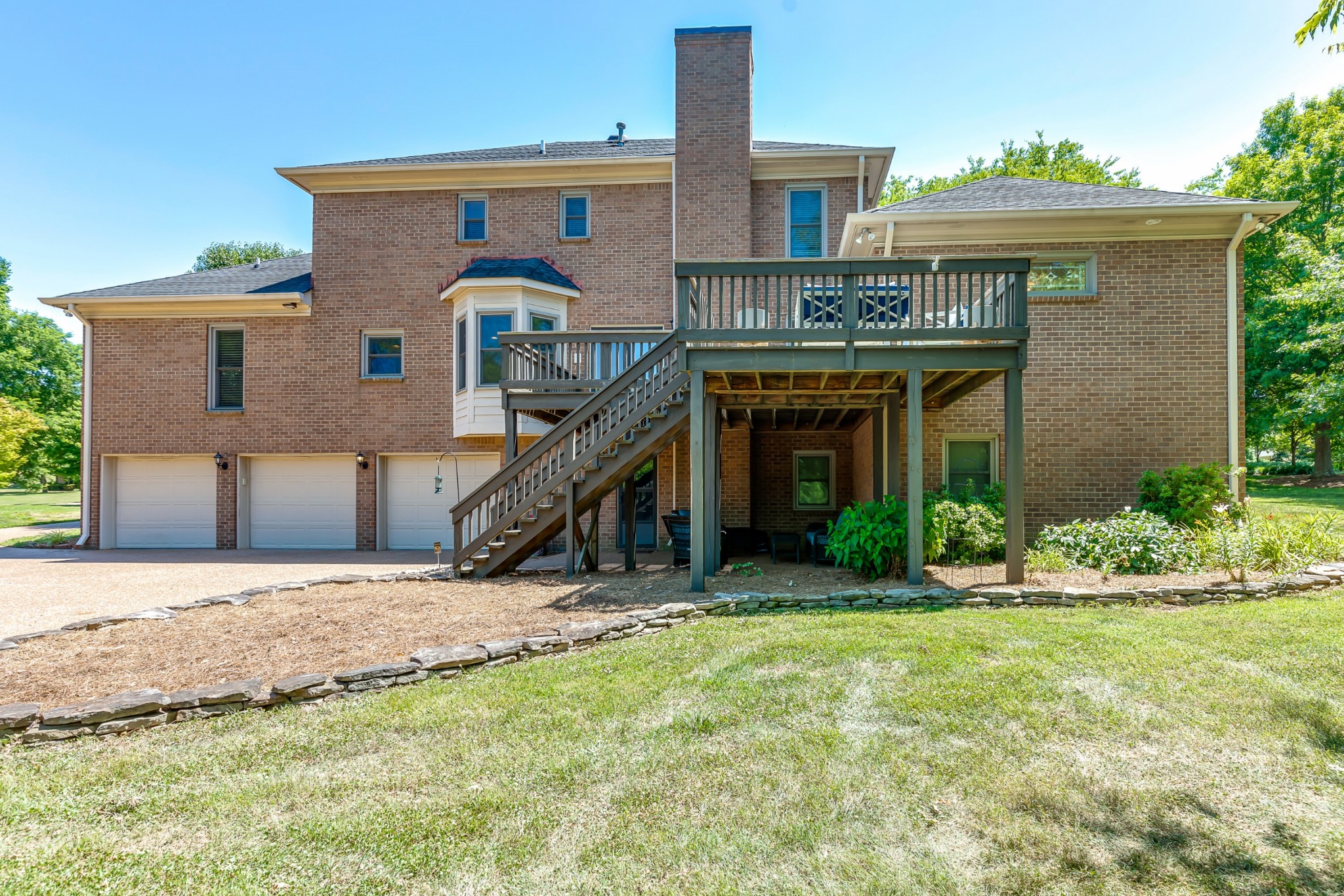 8204 Alamo Road Brentwood, TN 37027 - Photo 35 of 41 a front view of a house with a yard