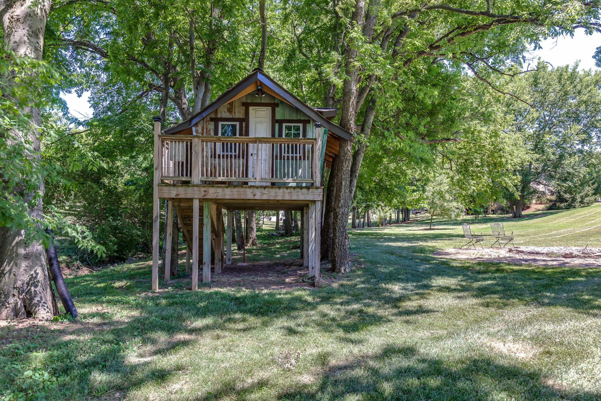 8204 Alamo Road Brentwood, TN 37027 - Photo 39 of 41 a view of a wooden house with a small yard and large trees