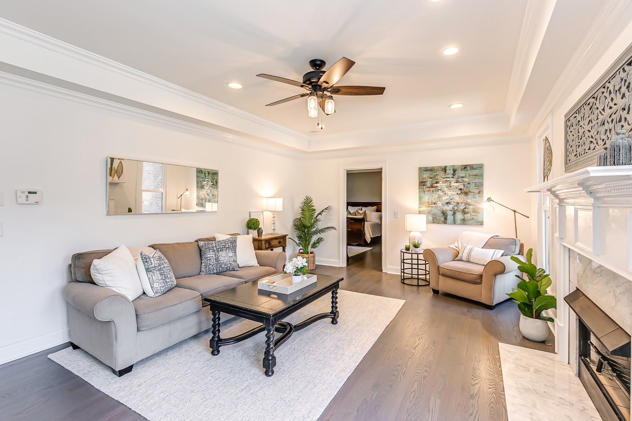 8204 Alamo Road Brentwood, TN 37027 - Photo 8 of 41 a living room with furniture a chandelier and a rug
