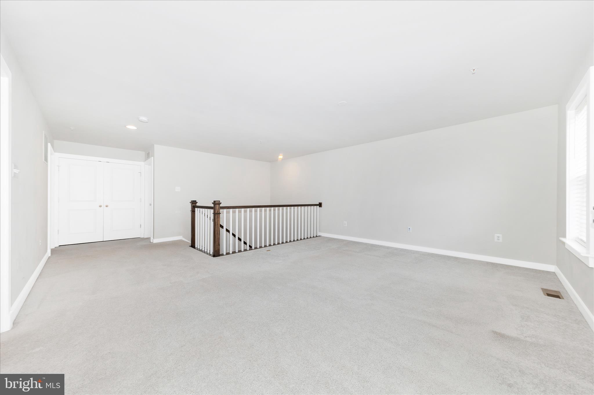 2003 Foster Way Frederick, MD 21702 - Photo 33 of 74 an empty room with staircase and white walls