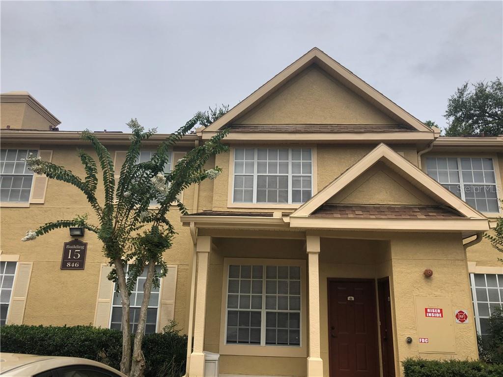 846 Grand Regency Pointe, Unit 101 Altamonte Springs, FL 32714 - Photo 1 of 1 a front view of a house with a yard