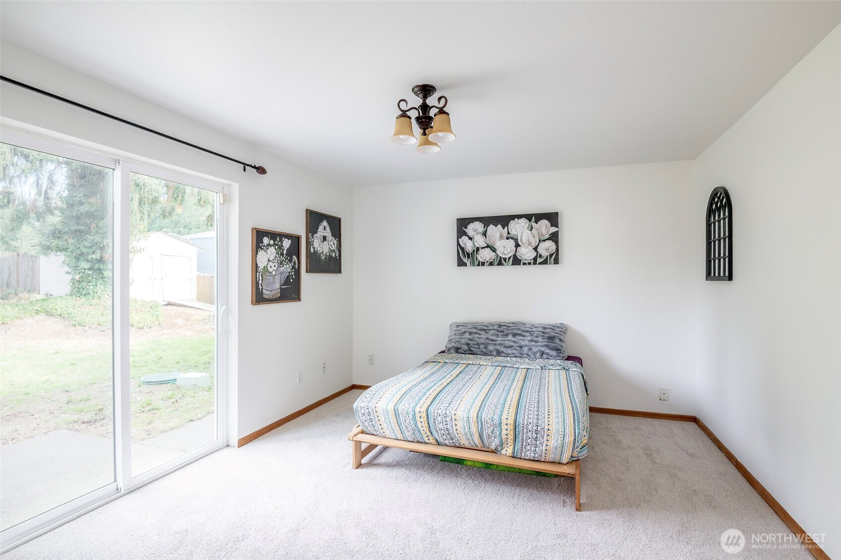 8903 216th St Court East Graham, WA 98338 - Photo 11 of 31 a bedroom with a bed and a painting on the wall