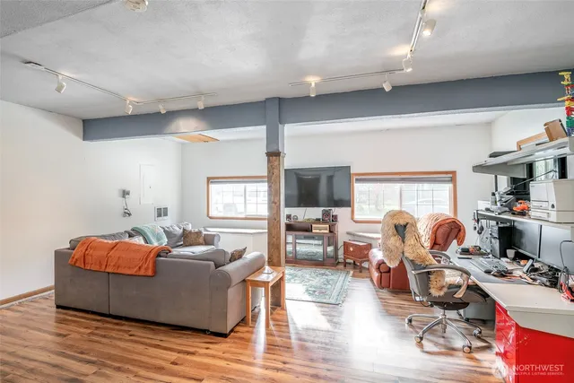 a living room with furniture fireplace and a flat screen tv