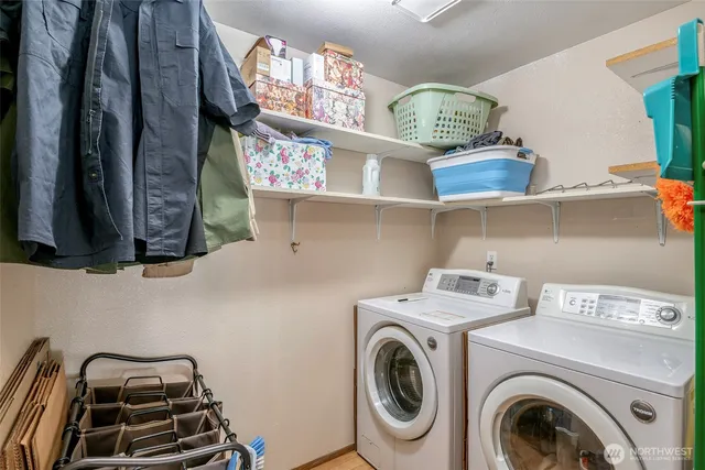 a view of storage and utility room with a washer and dryer