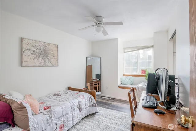 a bedroom with bed and a window