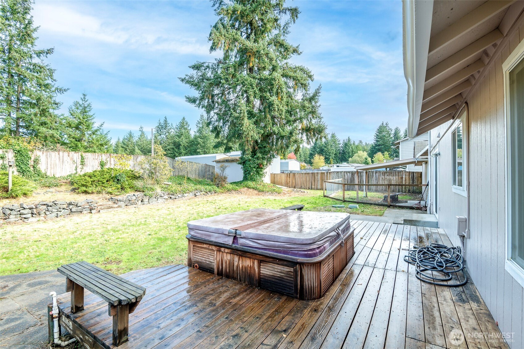 8903 216th St Court East Graham, WA 98338 - Photo 25 of 31 a view of a wooden deck with furniture