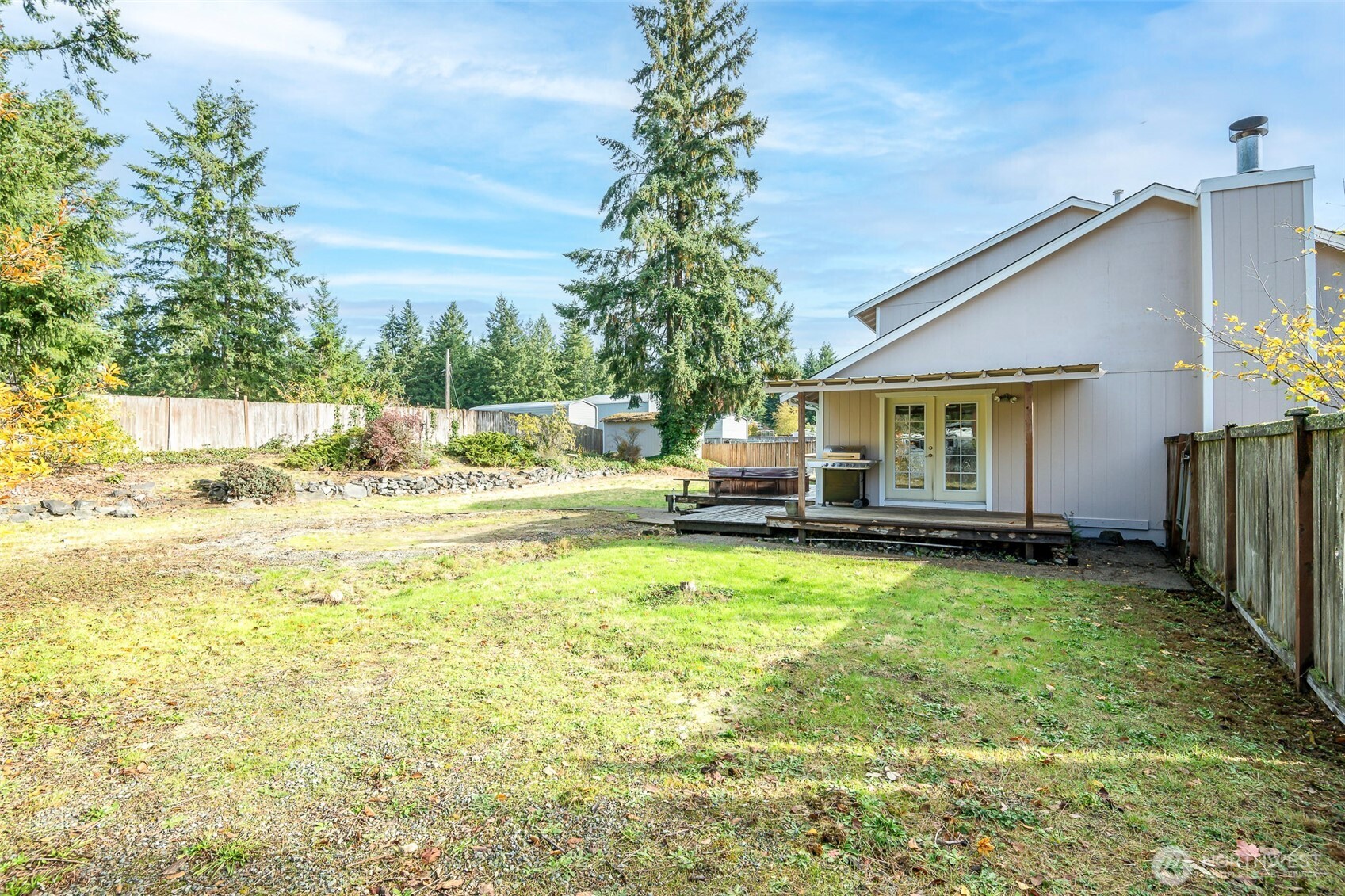 8903 216th St Court East Graham, WA 98338 - Photo 27 of 31 a swimming pool with outdoor seating and yard