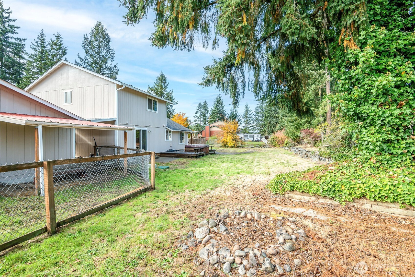 8903 216th St Court East Graham, WA 98338 - Photo 29 of 31 a view of a small house with garage