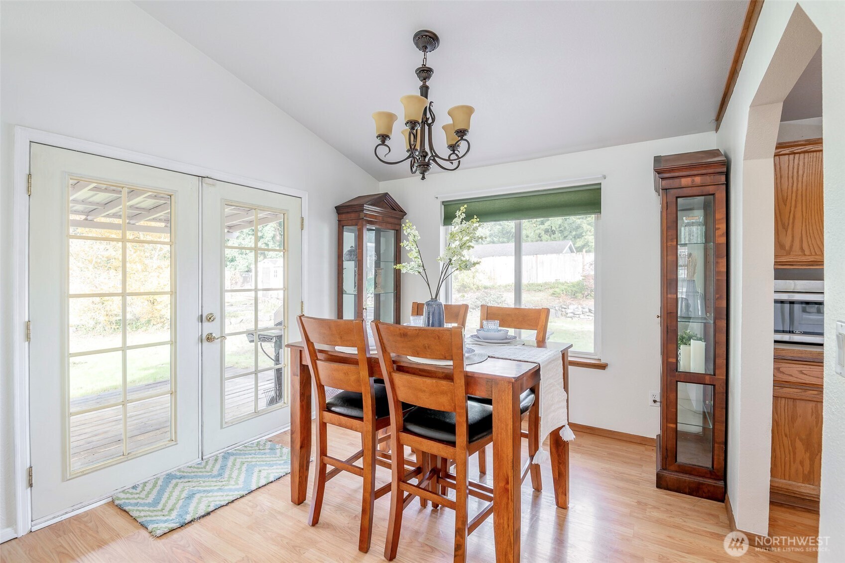 8903 216th St Court East Graham, WA 98338 - Photo 7 of 31 a view of a dining room with furniture window and wooden floor