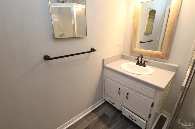 a bathroom with a sink and a mirror