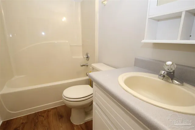a bathroom with a sink a toilet and a bathtub